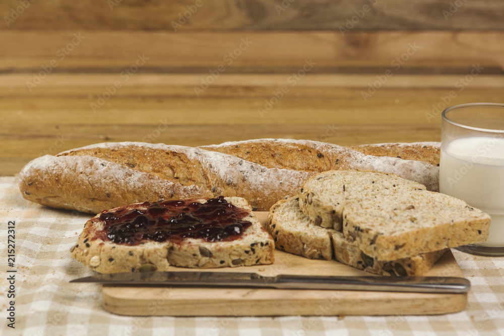 Morning easy breakfast, bread, jam , and cornflakes on wooden background Morning easy breakfast, bread, jam , and cornflakes on wooden background