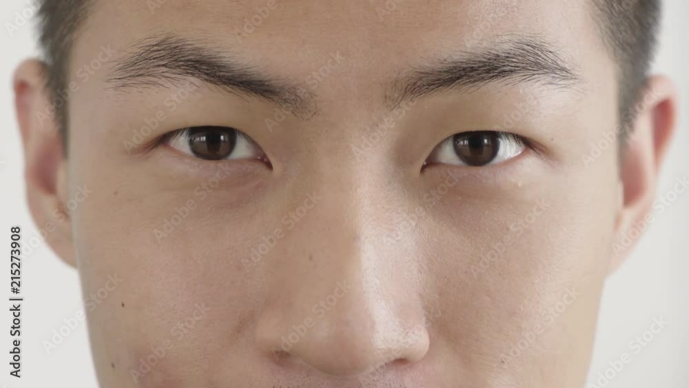 close up asian man face smiling looking happy winking perfect skin close up asian man face smiling looking happy winking perfect skin