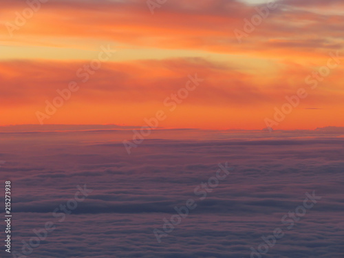 sunset between clouds layers