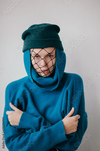 Stylish woman with net on face photo