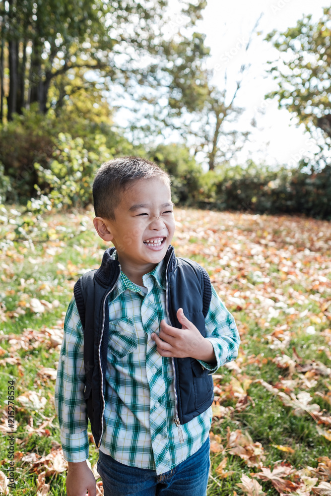 Happy Asian Kid Outdoor During Autumn Season Happy Asian Kid Outdoor During Autumn Season