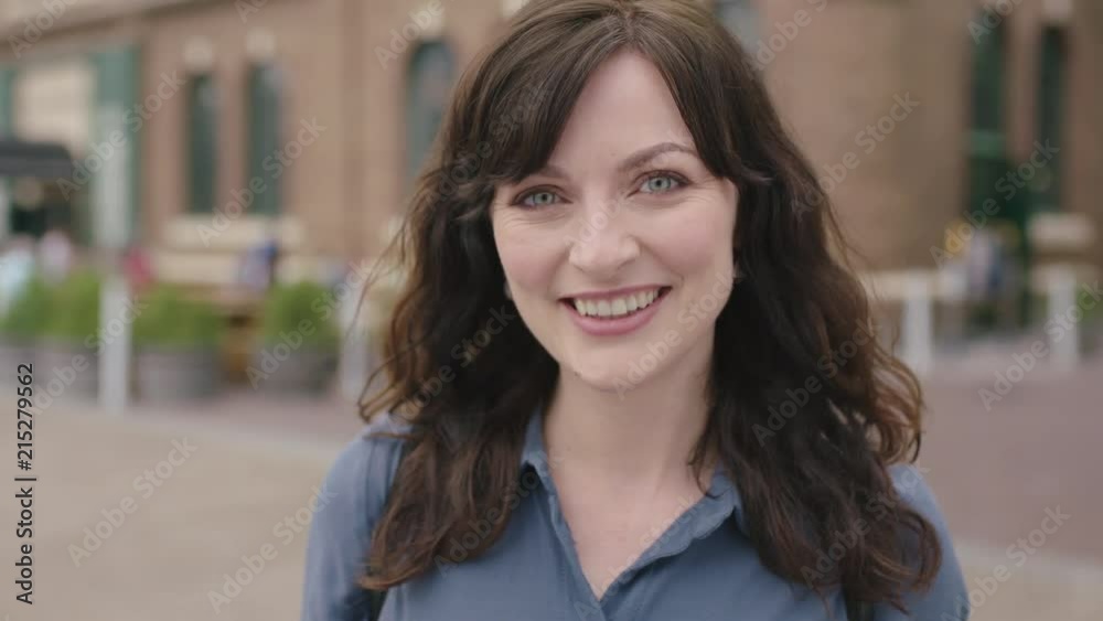 portrait of lovely elegant independent woman smiling happy confident on busy urban sidewalk portrait of lovely elegant independent woman smiling happy confident on busy urban sidewalk