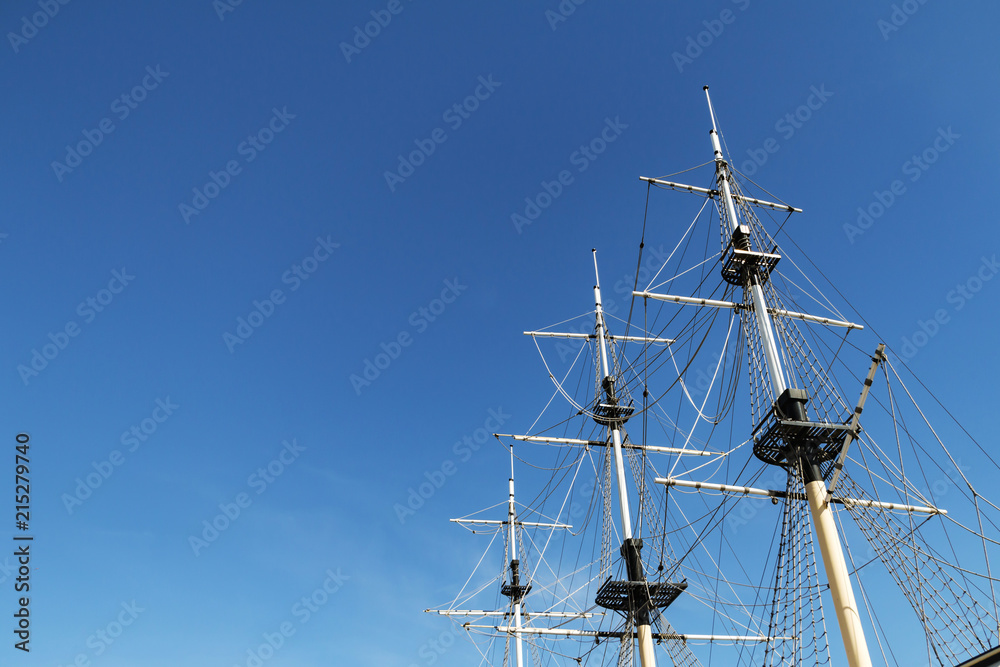 Sea ship masts and ropes against blue sky. Concept of travel, adventure and sea. Copy space. Sea ship masts and ropes against blue sky. Concept of travel, adventure and sea. Copy space.