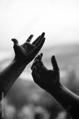 movement of two hands in black and white