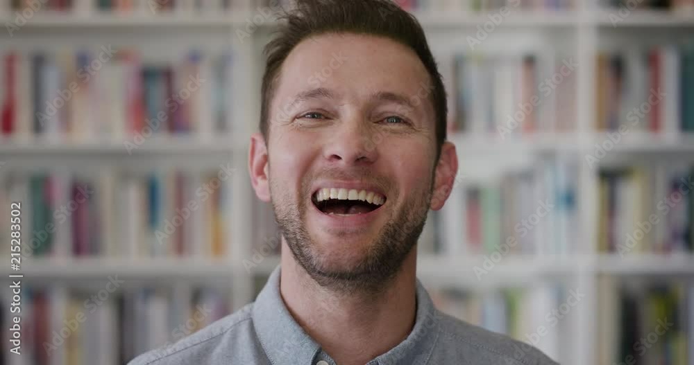 portrait happy caucasian man teacher laughing enjoying successful education career lifestyle in bookshelf library background portrait happy caucasian man teacher laughing enjoying successful education career lifestyle in bookshelf library background