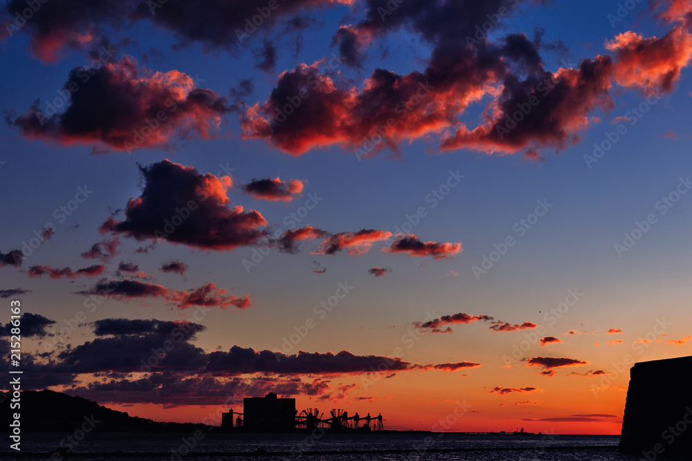 silhouettes of the banks of the river Tagus, wonderful shades in the sky from the sunset