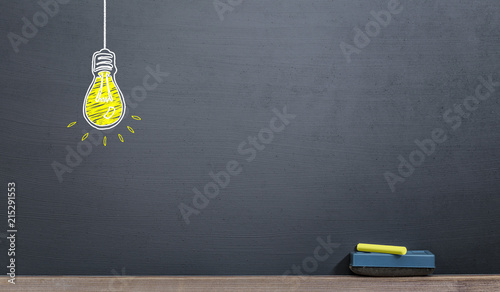 handwriting yellow bulb on the blackboard with chalk, idea concept