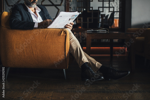 Man Reading Newspaper