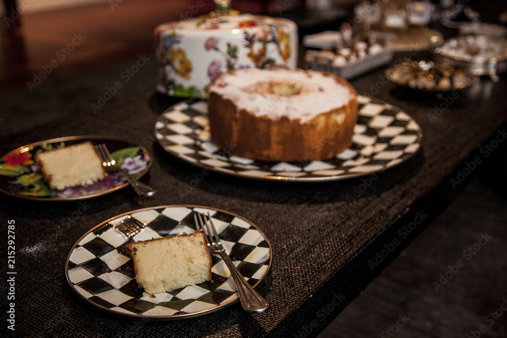 slice of cake with powder sugar on top on a dark wood background. selective focus slice of cake with powder sugar on top on a dark wood background. selective focus