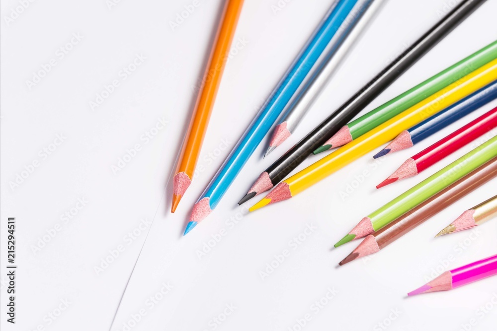 colorful drawing pencils isolated on white paper. top view crayons