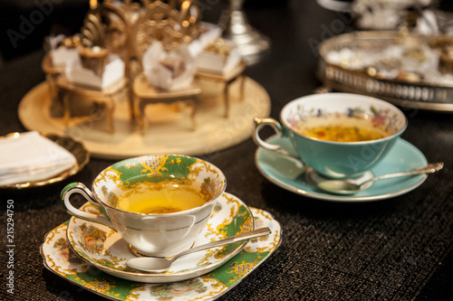 Obraz na plátně elegant tea cup on a dark wooden table.