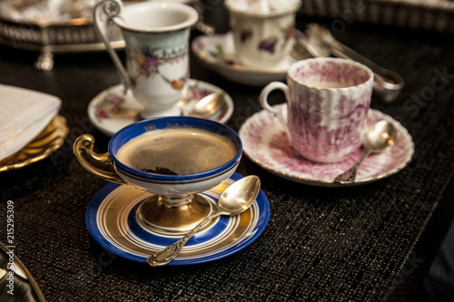 elegant cooffe cup on a dark wooden table.