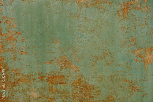 green red rusty metal texture from an old wall