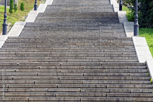 gray concrete steps on a long stone staircase