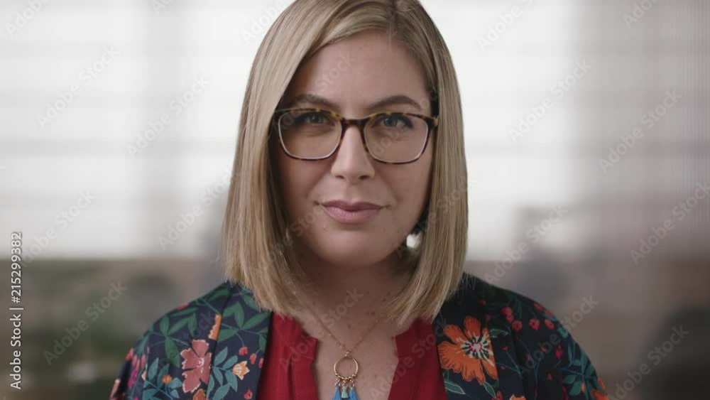 close up portrait of friendly blonde business woman smiling happy looking at camera wearing glasses in office workplace background close up portrait of friendly blonde business woman smiling happy looking at camera wearing glasses in office workplace background