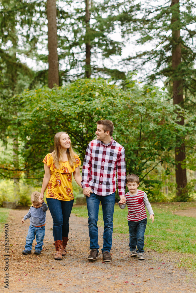 Cute, Fun Family Walking in Park Cute, Fun Family Walking in Park