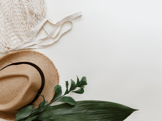 Creative summer  layout with hipster hat on pastel background