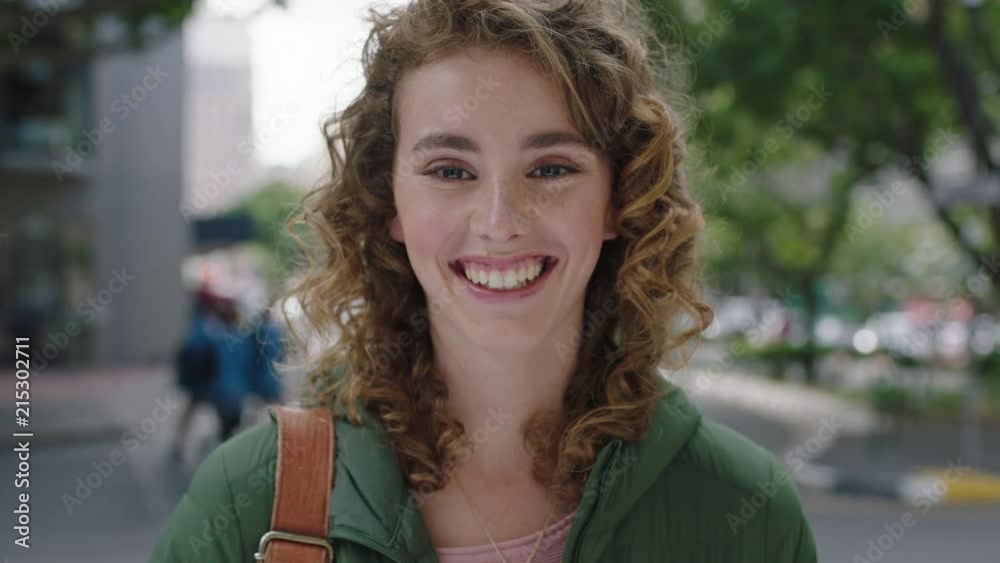 portrait of beautiful young elegant woman redhead on city street laughing cheerful optimistic enjoying happy urban lifestyle portrait of beautiful young elegant woman redhead on city street laughing cheerful optimistic enjoying happy urban lifestyle