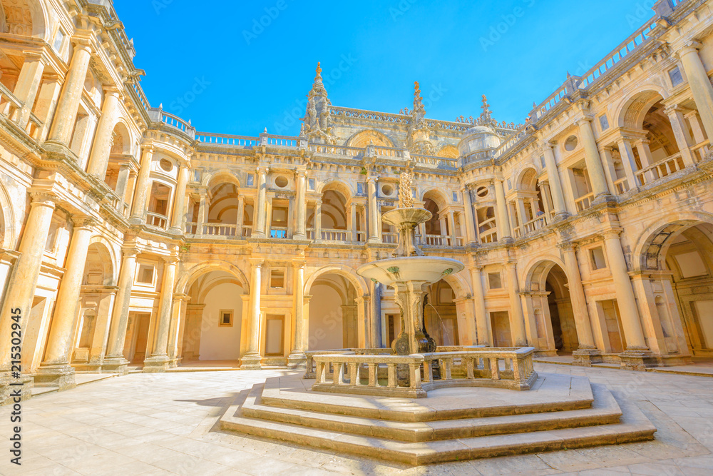 Portugal, Tomar. Bottom view of claustro de D. Joao III, courtyard with fountain of Convent of Christ in Templar Castle. Unesco Heritage and popular destination in Europe.