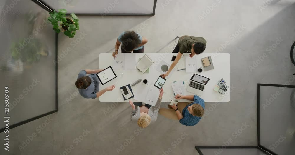 top view business people working on corporate project brainstorming ideas using research data multitasking in boardroom meeting top view