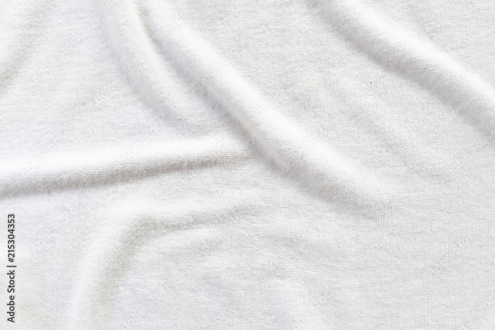 White towel texture background with abstract pattern. That fabric or textile consist of cotton fiber or natural material. For absorb water, drying and wiping in bathroom, laundry and kitchen room. White towel texture background with abstract pattern. That fabric or textile consist of cotton fiber or natural material. For absorb water, drying and wiping in bathroom, laundry and kitchen room.