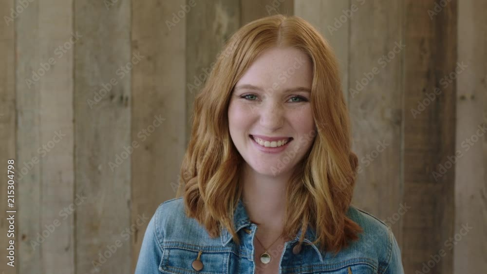 young stylish red head woman close up portrait of beautiful girl laughing cheerful at camera wearing denim jacket wooden background young stylish red head woman close up portrait of beautiful girl laughing cheerful at camera wearing denim jacket wooden background
