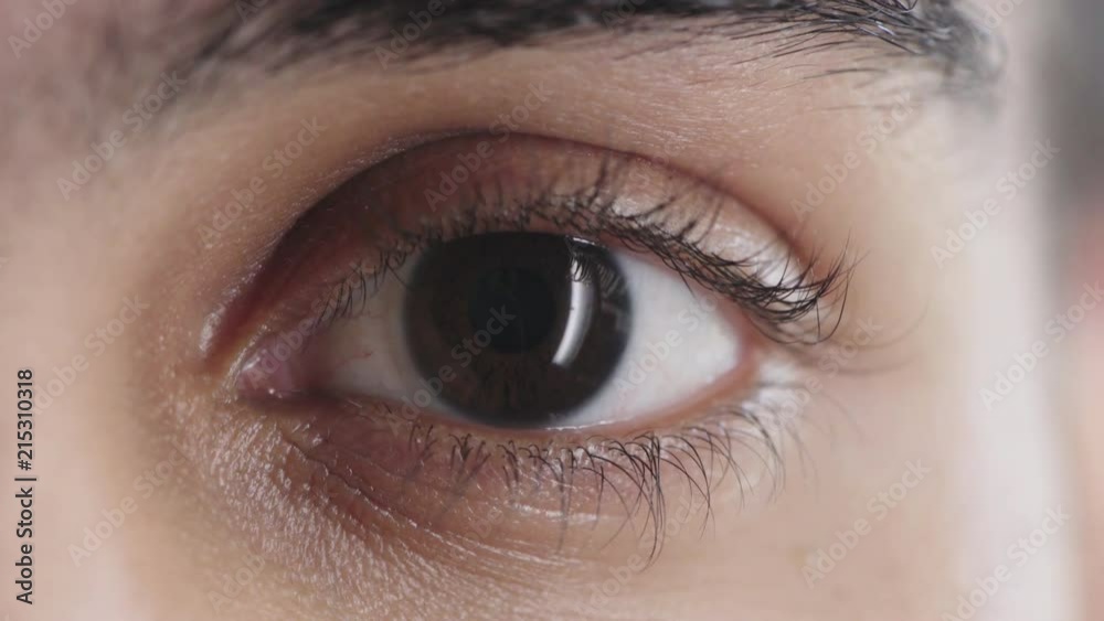 close up beautiful male eye blinking looking at camera human iris beauty close up beautiful male eye blinking looking at camera human iris beauty