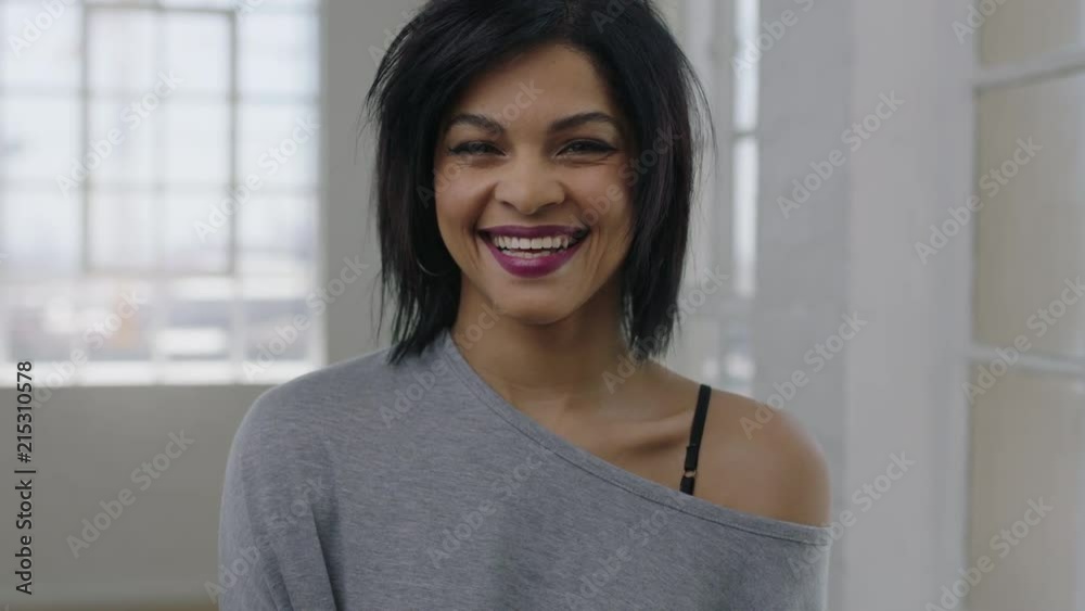 portrait of independent young mixed race woman laughing cheerful looking at camera enjoying positive lifestyle portrait of independent young mixed race woman laughing cheerful looking at camera enjoying positive lifestyle