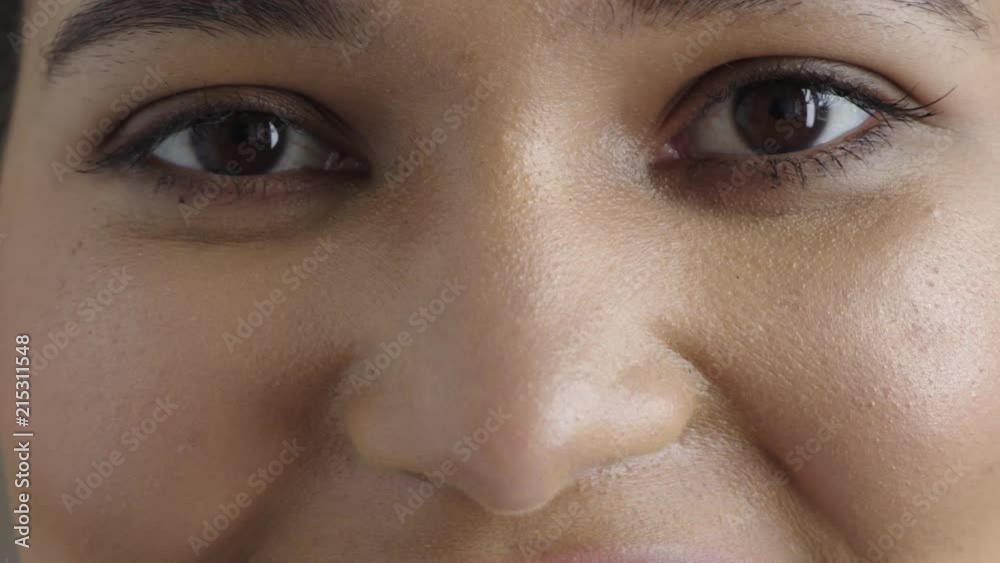 close up young woman eyes looking happy smiling at camera close up young woman eyes looking happy smiling at camera