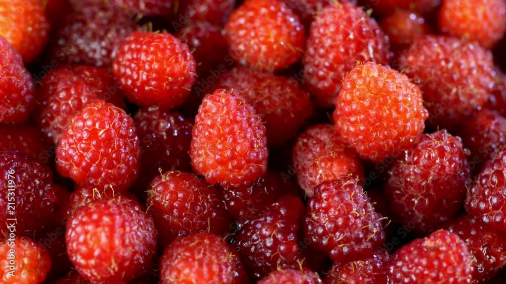 Fresh raspberry fruits as food background. Healthy food organic nutrition. View from above.