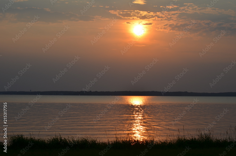 sunset on the reservoir coast
