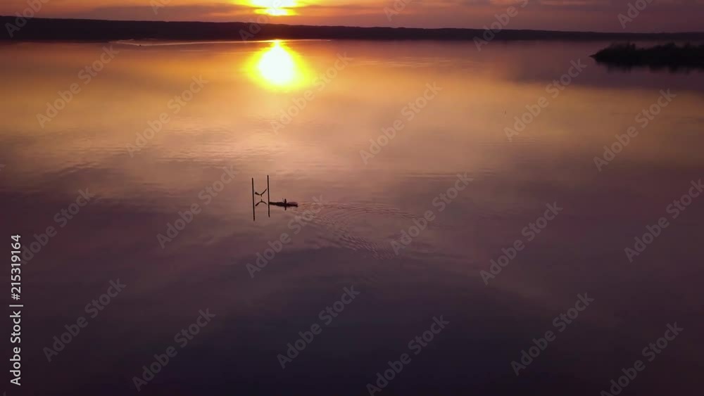 Kayaking at sunrise, Lake Ammersee aerial, drone view. Germany. Kayaking at sunrise, Lake Ammersee aerial, drone view. Germany.