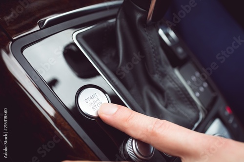 Male executive using starter of car