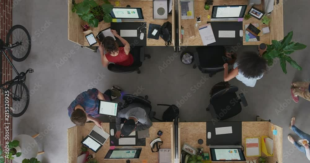 top view young multi ethnic business team in lively office workspace diverse employees interacting discussing startup work strategy time lapse