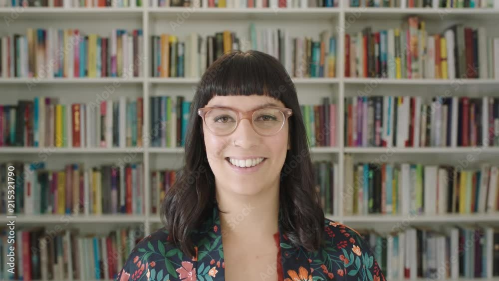 Portrait young woman student smiling bookshelf library university Portrait young woman student smiling bookshelf library university