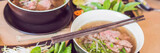 Pho Bo - Vietnamese fresh rice noodle soup with beef, herbs and chili. Vietnam's national dish BANNER, long format