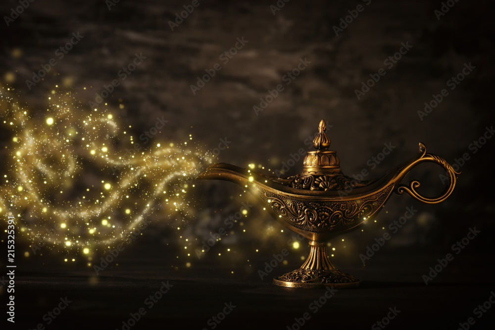 Image of magical mysterious aladdin lamp with glitter sparkle smoke