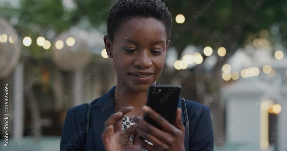 portrait professional african american business woman using smartphone browsing online enjoying reading messages on mobile phone in city