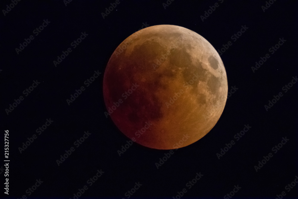 Lunar Eclipse: phase of  blood moon completely covered by  shadow of the Earth from the sun