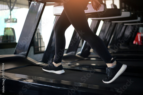 Female fitness run on treadmill