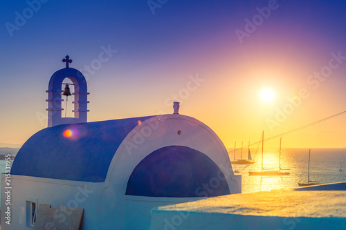 Mykonos with boats and white buildings at sunset, Cyclades islands, Greece