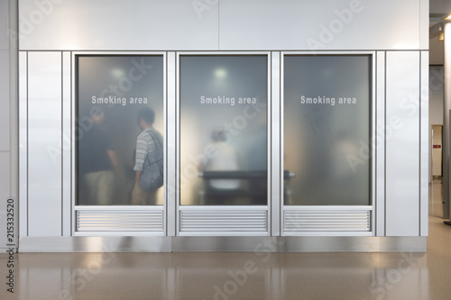 Smoking area zone,Smoking  sign (English ,Chinese,Korean):Unidentified poeple smoke in designated smoking area . Smoking and waking is strictly prohibited in most of the public area