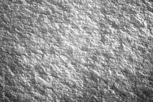 Abstract black and white textured contrast the background surface of the snow. Texture