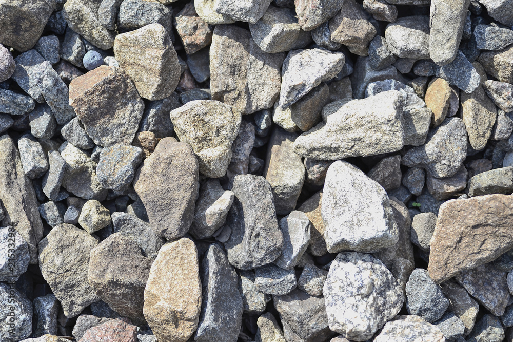 Stone rubble in the construction of the road for vehicles. Textured background Stone rubble in the construction of the road for vehicles. Textured background
