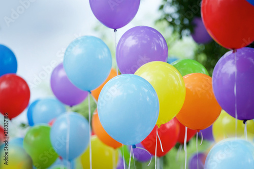 Balloons of different colors filled with helium photo