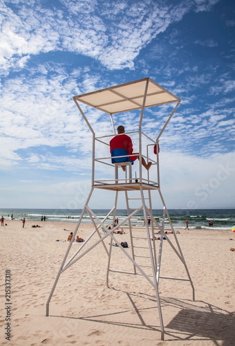 Rescue tower with savior near the sea