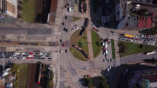 Top view of the road junctions. Aerial survey of highways of the road network. Cars moving at the intersection and denouement. Organization of traffic from a bird's eye view. Summer road. photo