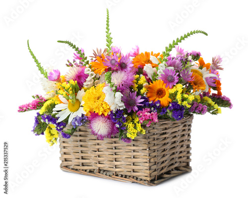 Fototapeta Naklejka Na Ścianę i Meble -  Wicker basket with beautiful wild flowers on white background