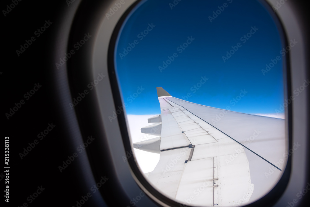 aircraft window with blue sky. aircraft window with blue sky.