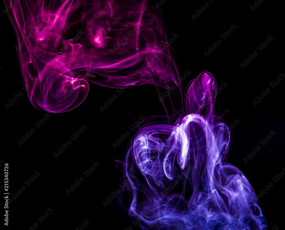 Obraz premium Colored smoke on black background